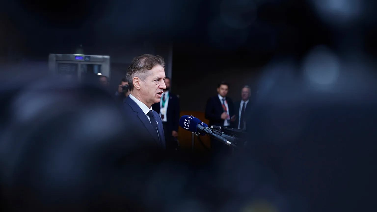 Slovenia's Prime Minister Robert Golob speaks with the media as he arrives for an EU summit at the European Council building in Brussels, 26 June 2025