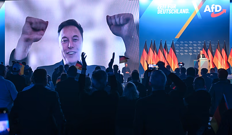 U.S. businessman Elon Musk is shown during a live video link during the AfD's election campaign kick-off, in Halle, Germany, Saturday, Jan. 25, 2025.