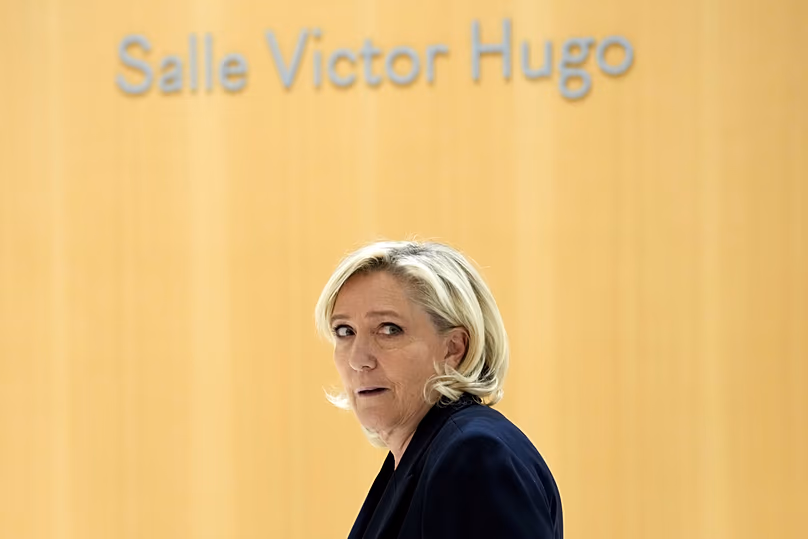 FILE- French far-right leader Marine Le Pen arrives at the courtroom for the trial over the suspected embezzlement of European Parliament funds, Wednesday, Nov. 6, 2024,Paris.
