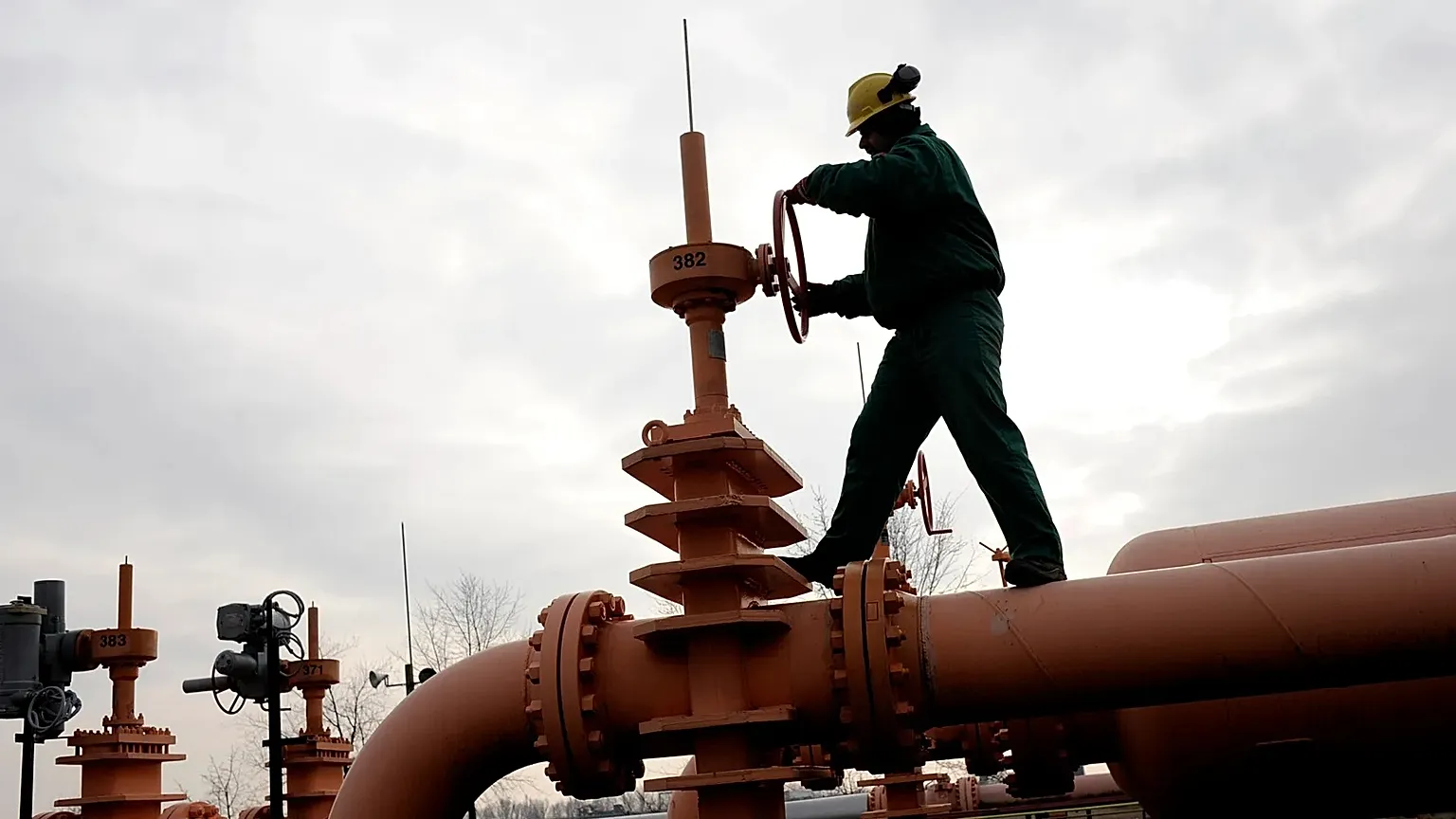 An employee of the Hungarian Mol Natural Gas Transporting Corporation checks the pressure in the pipeline forwarding Russian natural gas from Ukraine.