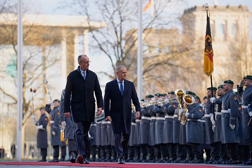German Chancellor Friedrich Merz, left, welcomes Poland's Prime Minister Donald Tusk, right, for the German-Polish government consultations at the Chancellery in Berlin.