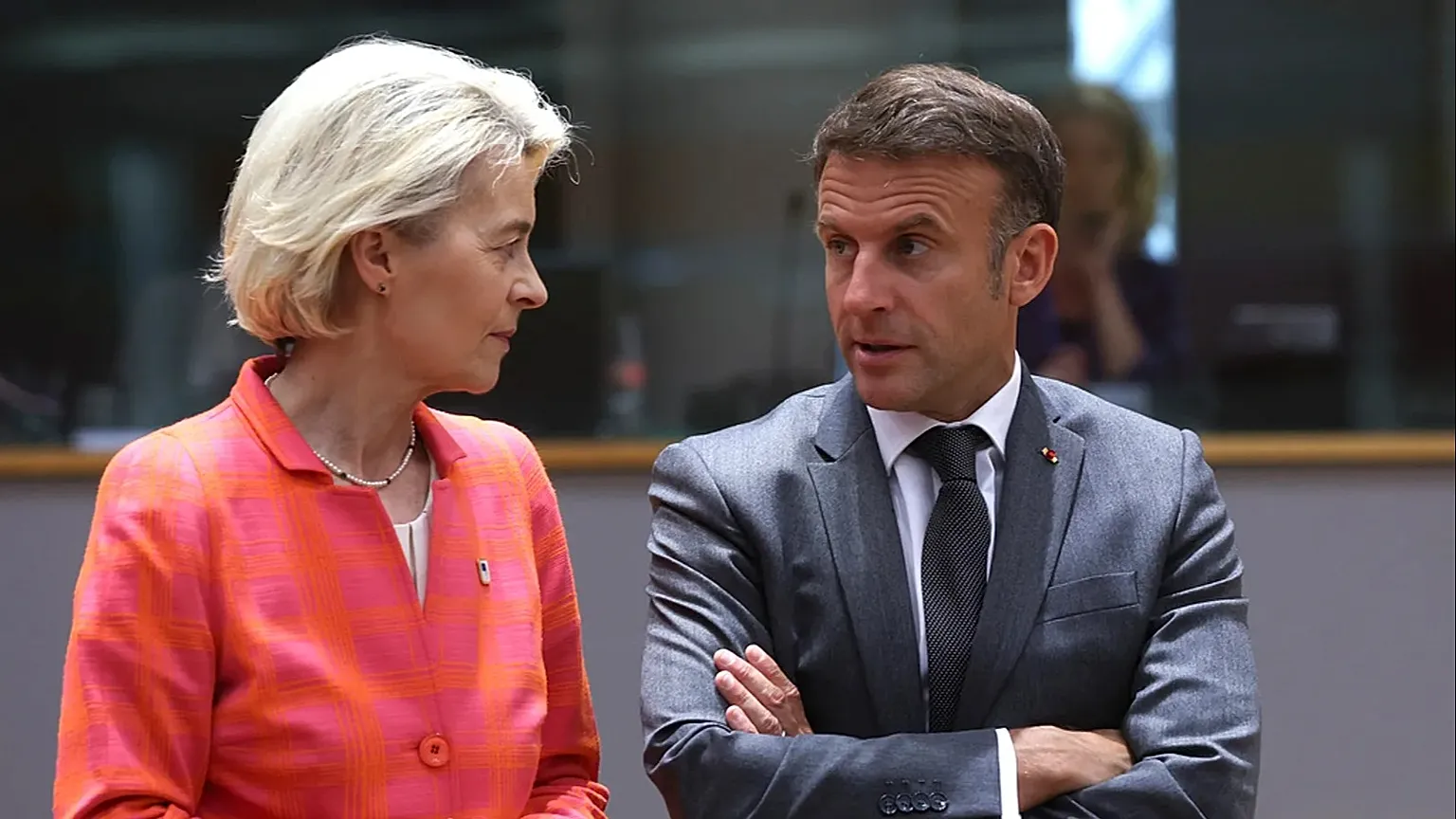 French President Emmanuel Macron, right, speaks with European Commission President Ursula von der Leyen during a round table meeting at an EU summit in Brussels.