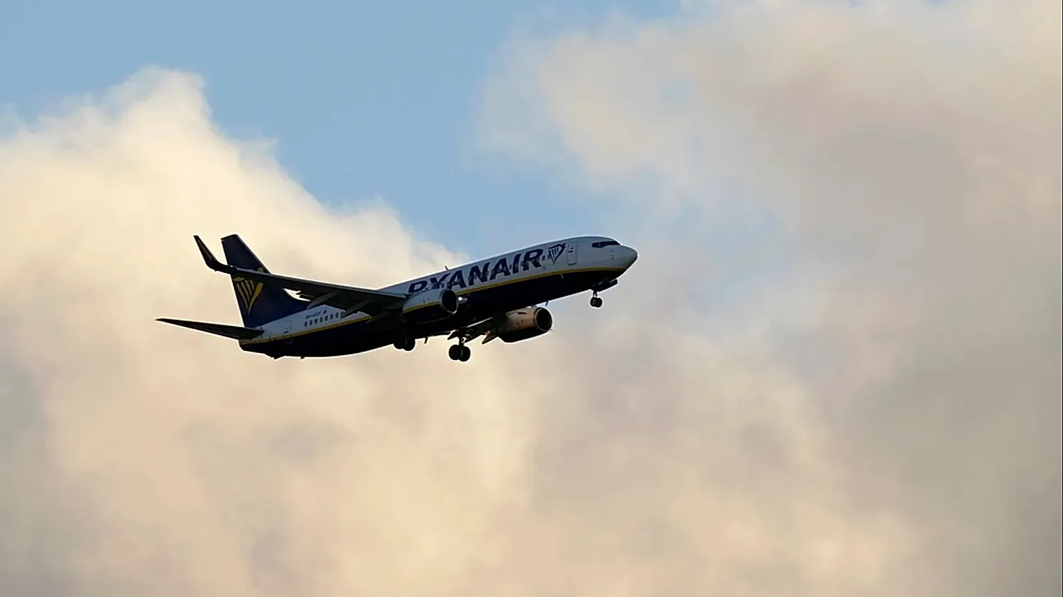 A Ryanair Boeing 737 approaches for landing in Lisbon, at sunset, Tuesday, June 13, 2023.