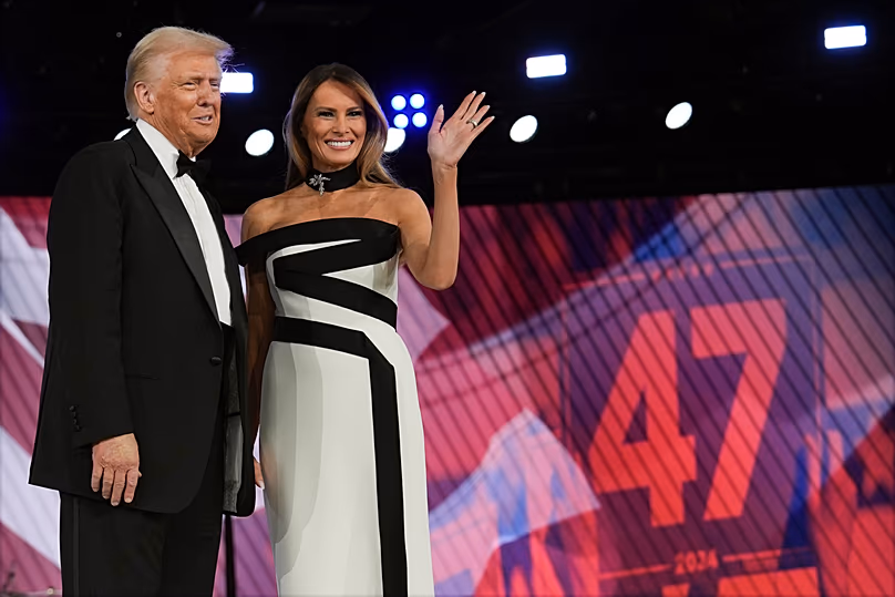 US President Donald Trump and first lady Melania Trump wave at the 60th Presidential Inauguration in Washington, 20 January, 2025
