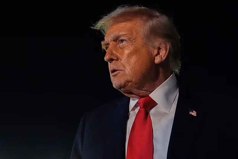 President Donald Trump speaks to reporters before boarding Air Force One at Palm Beach International Airport, Monday, Jan. 19, 2026, in West Palm Beach, Fla.