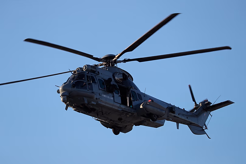 A French Caracal helicopter flies over a military base in Orleans, central France, Thursday, Jan. 16, 2020. (Ludovic Marin/Pool Photo via AP)
