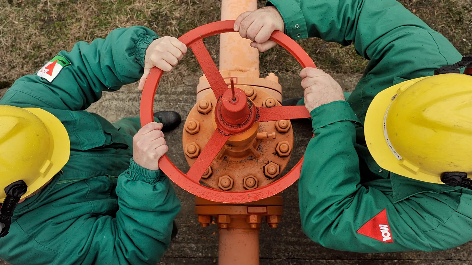 Engineers of the FGSZ Ltd, Hungary's natural gas transporting company, turn a valve of a gas pipeline forwarding natural gas from underground storage facilities.