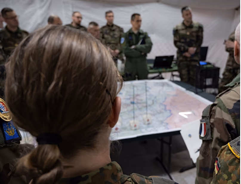 French and allied soldiers during a briefing.