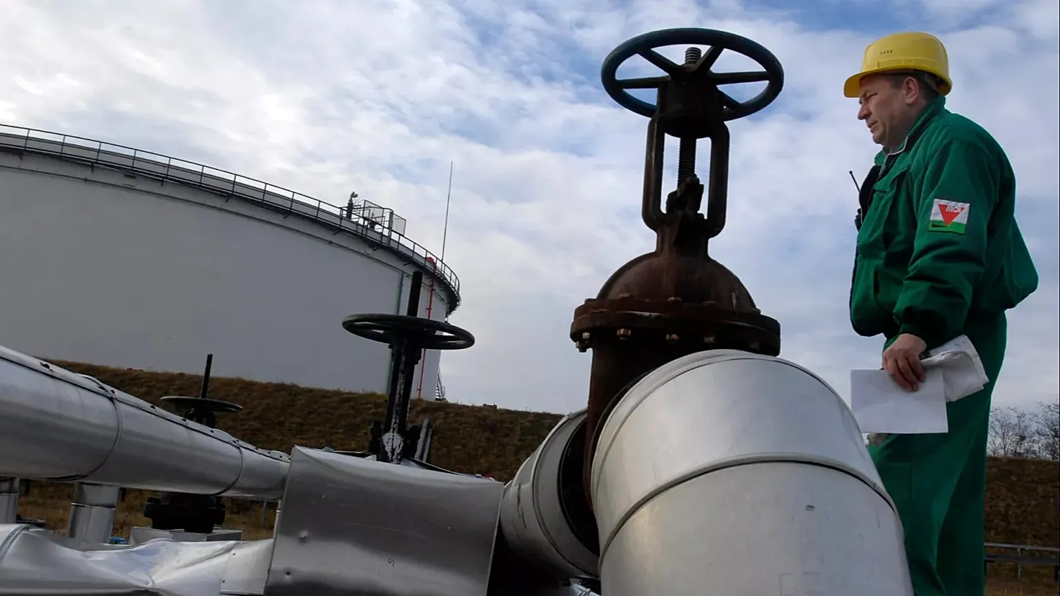 An engineer of the Hungarian Oil and Gas Company checks the receiving area of the Druzhba oil pipeline at the country's largest oil refinery in Szazhalombata.