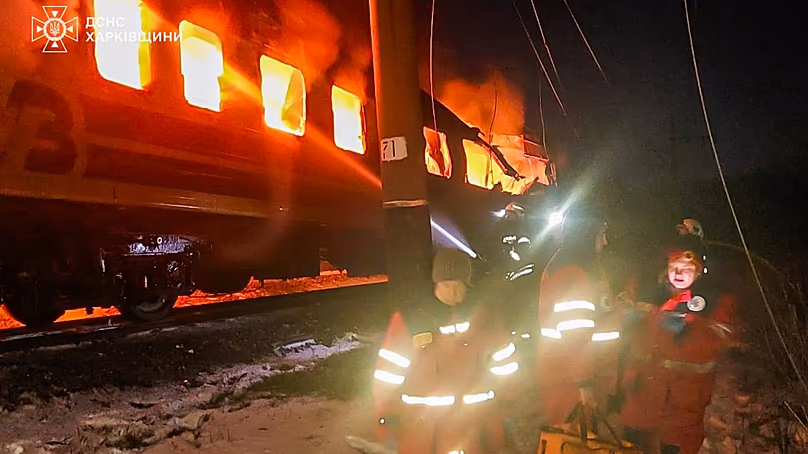 In this photo provided by the Ukrainian Emergency Service, firefighters put out the fire after Russian drones hit a passenger train, Jan. 27, 2026. 