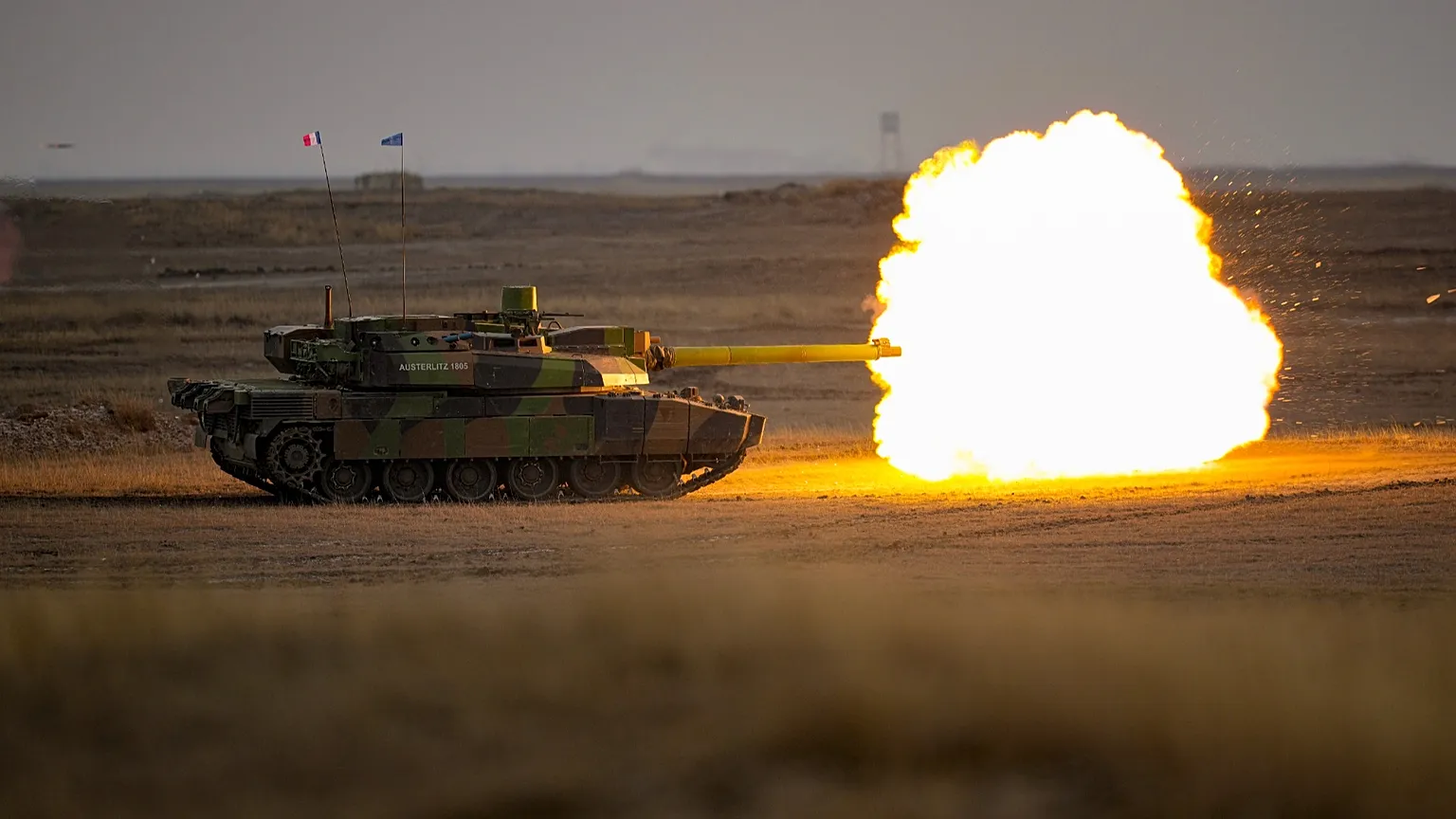 French Leclerc main battle tanks fire during an exercise at a training range in Smardan, eastern Romania, Wednesday, Jan. 25, 2023.