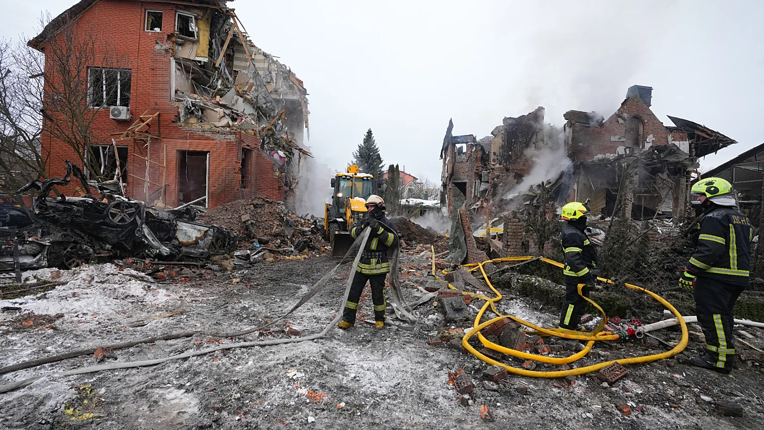 Firefighters put out a fire after a drone hit a residential building during a Russian air attack in Kyiv, Ukraine, Sunday, Feb. 22, 2026.