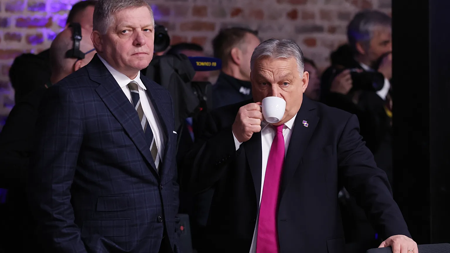 Hungary's Prime Minister Viktor Orban, right, speaks with Slovakia's Prime Minister Robert Fico during a round table meeting for the EU summit at Alden Biesen Castle in Bilzen