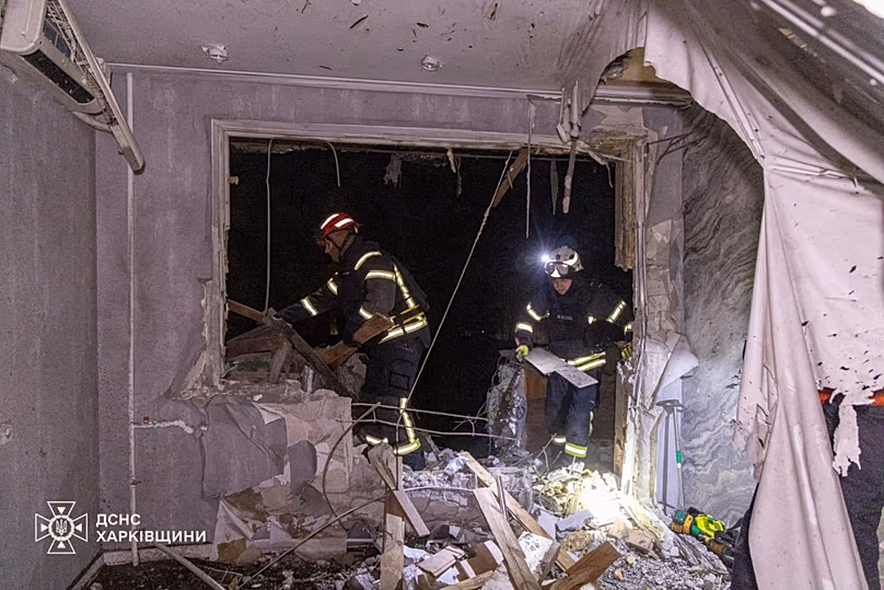Firefighters put out a fire in a residential building following a Russian drone attack in Kharkiv, 27 March, 2026