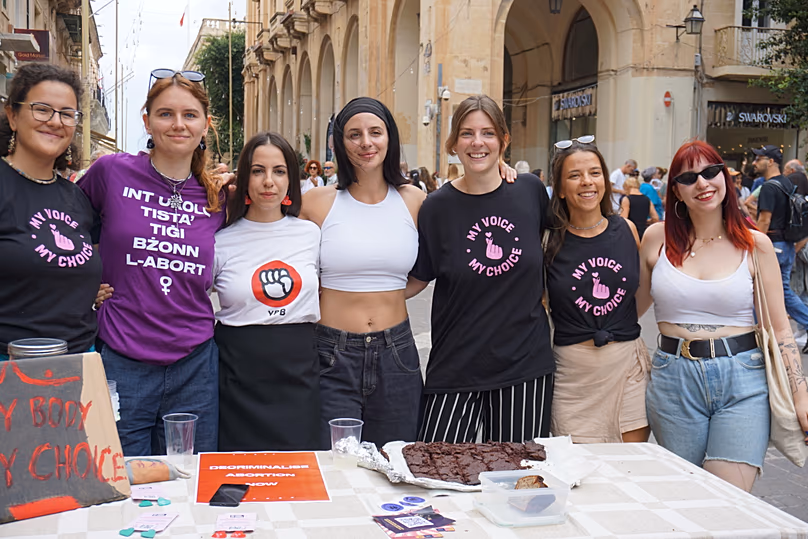 Women's rights activists, including Belle de Jong, pose for a photo at a pro-choice rally in Valletta on International Safe Abortion Day, Sept. 28, 2025. Valletta, Malta.