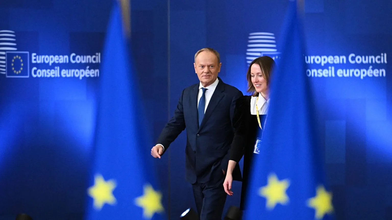 Poland's Prime Minister Donald Tusk, left, arrives for an EU summit at the European Council building in Brussels, 22 Jan 2026