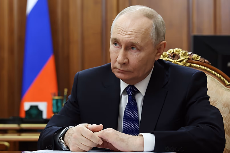 Russian President Vladimir Putin listens to Head of the Federal Treasury Roman Artyukhin at the Kremlin in Moscow, 3 March 2026
