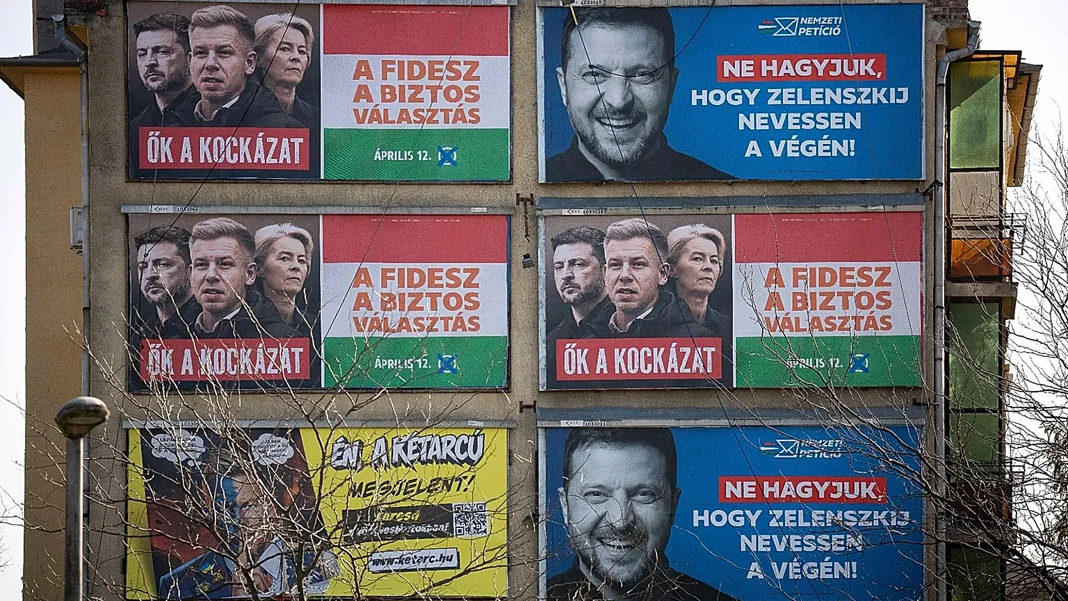 Campaign posters displayed on a wall in Budapest, 14 March, 2026