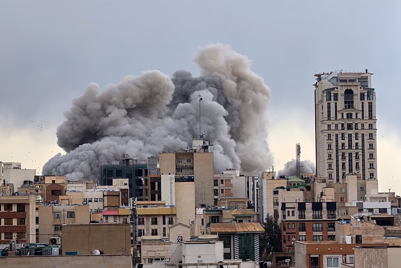 A plume of smoke rises after a strike in Tehran, 2 March, 2026