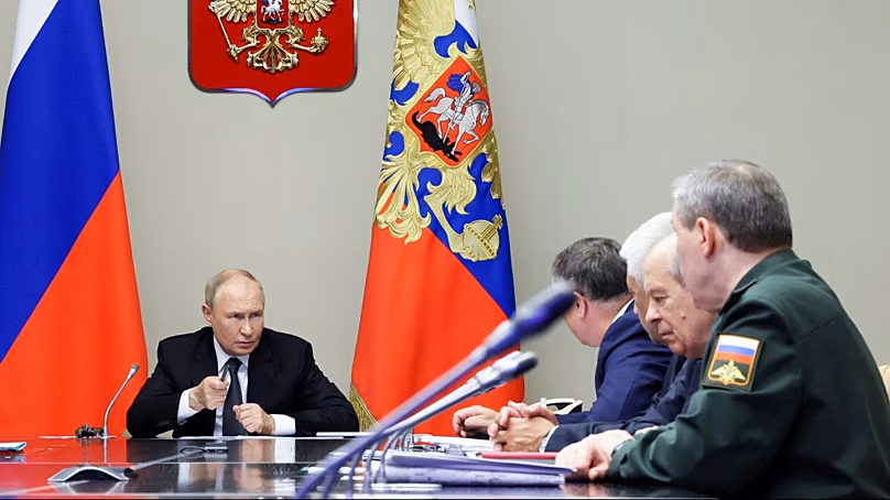 Russian President Vladimir Putin, left, leads a meeting with top security and defense officials (Gavriil Grigorov, Sputnik, Kremlin Pool Photo via AP, File)
