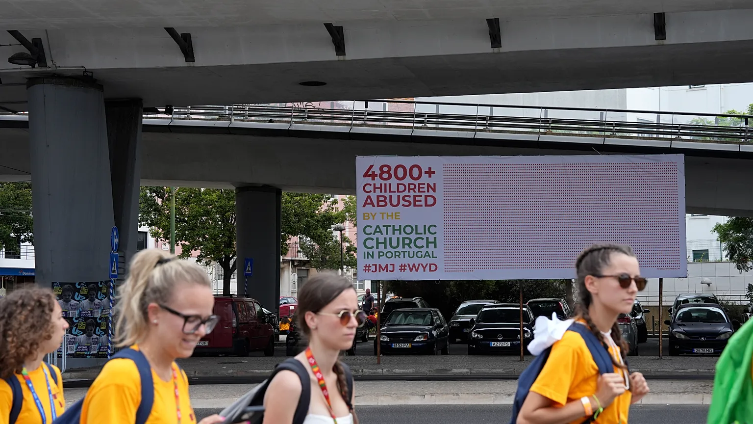Poster under a Lisbon overpass during World Youth Day 2023 in Lisbon, Portugal