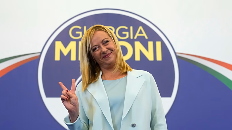 Far-Right party Brothers of Italy's leader Giorgia Meloni flashes the victory sign at her party's electoral headquarters in Rome, Sept. 26, 2022.