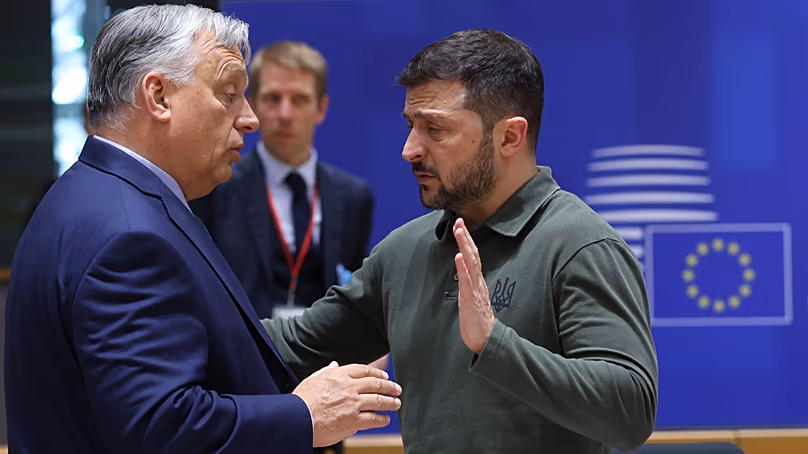 Hungary's Prime Minister Viktor Orban, left, speaks with Ukraine's President Volodymyr Zelenskyy. (Olivier Hoslet, Pool Photo via AP)