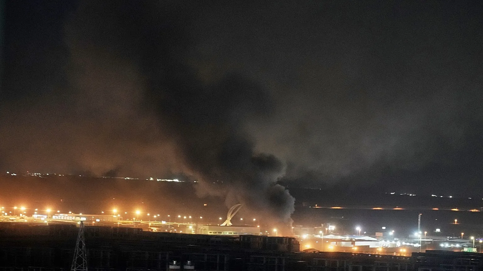 Smoke rises after an explosion at the airport in Irbil, Iraq, late Wednesday, March 11, 2026