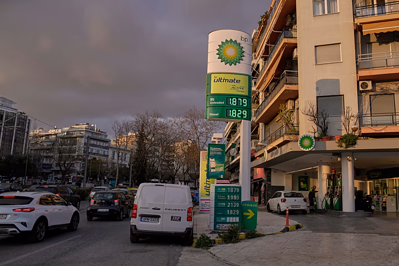 A sign showing current fuel prices stands outside a gas station in Athens, Greece, on Wednesday, March 11, 2026.