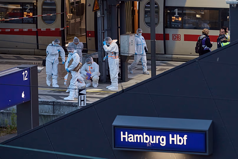 Police and forensics work near the crime scene after a stabbing attack at Hamburg Central Station, 23 May, 2025