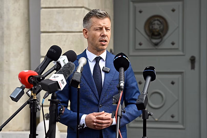 Peter Magyar, leader of the election-winning Tisza Party, talks to the media in Budapest, Hungary, Wednesday April 15, 2026. 