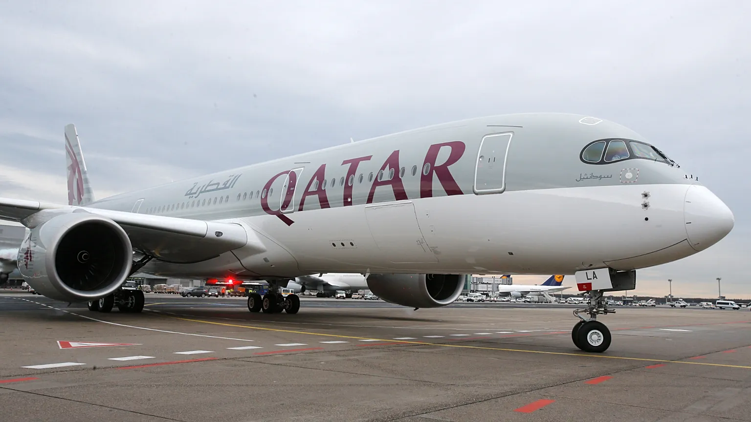 In this Jan. 15, 2015 file photo, a new Qatar Airways Airbus A350 approaches the gate at the airport in Frankfurt, Germany.