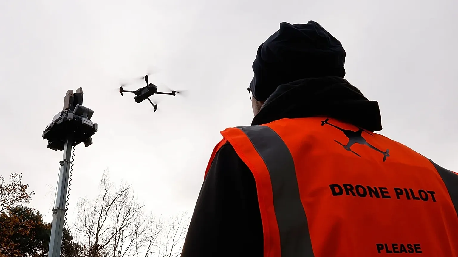 A drone operator flies a drone during a demonstration of a mobile counter drone system in Geel, 2 December, 2025