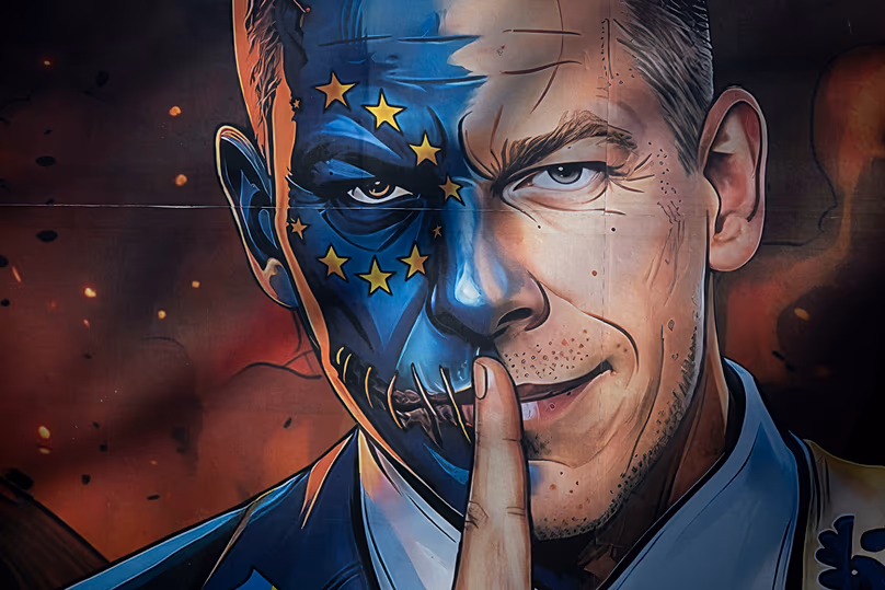 A campaign poster shows Péter Magyar, the leader of opposition, as a two-faced man, commanded by the EU