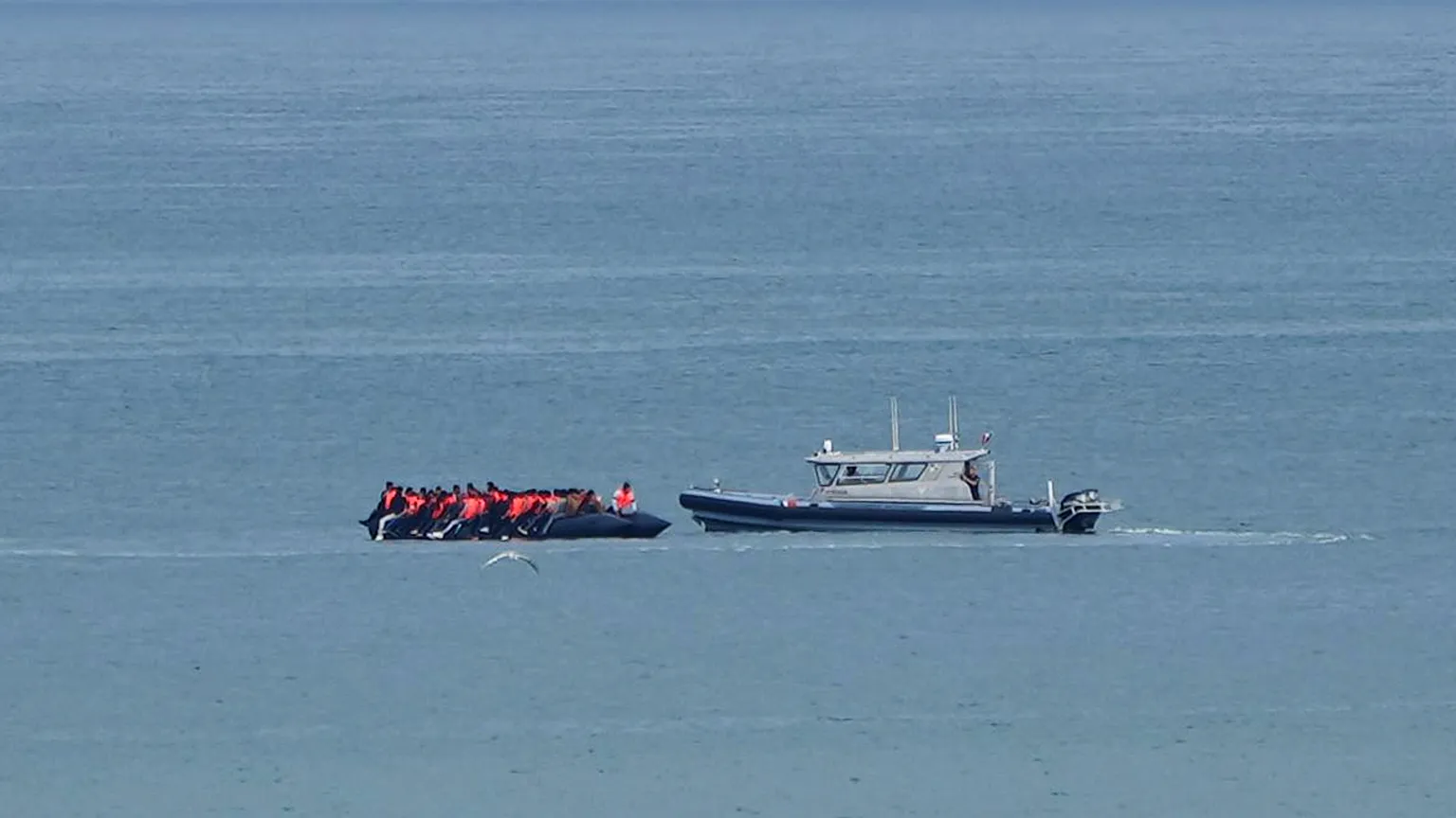 A boat suspected of transporting migrants is escorted by a French Gendarmerie vessel in the English Channel on 4 September 2024.