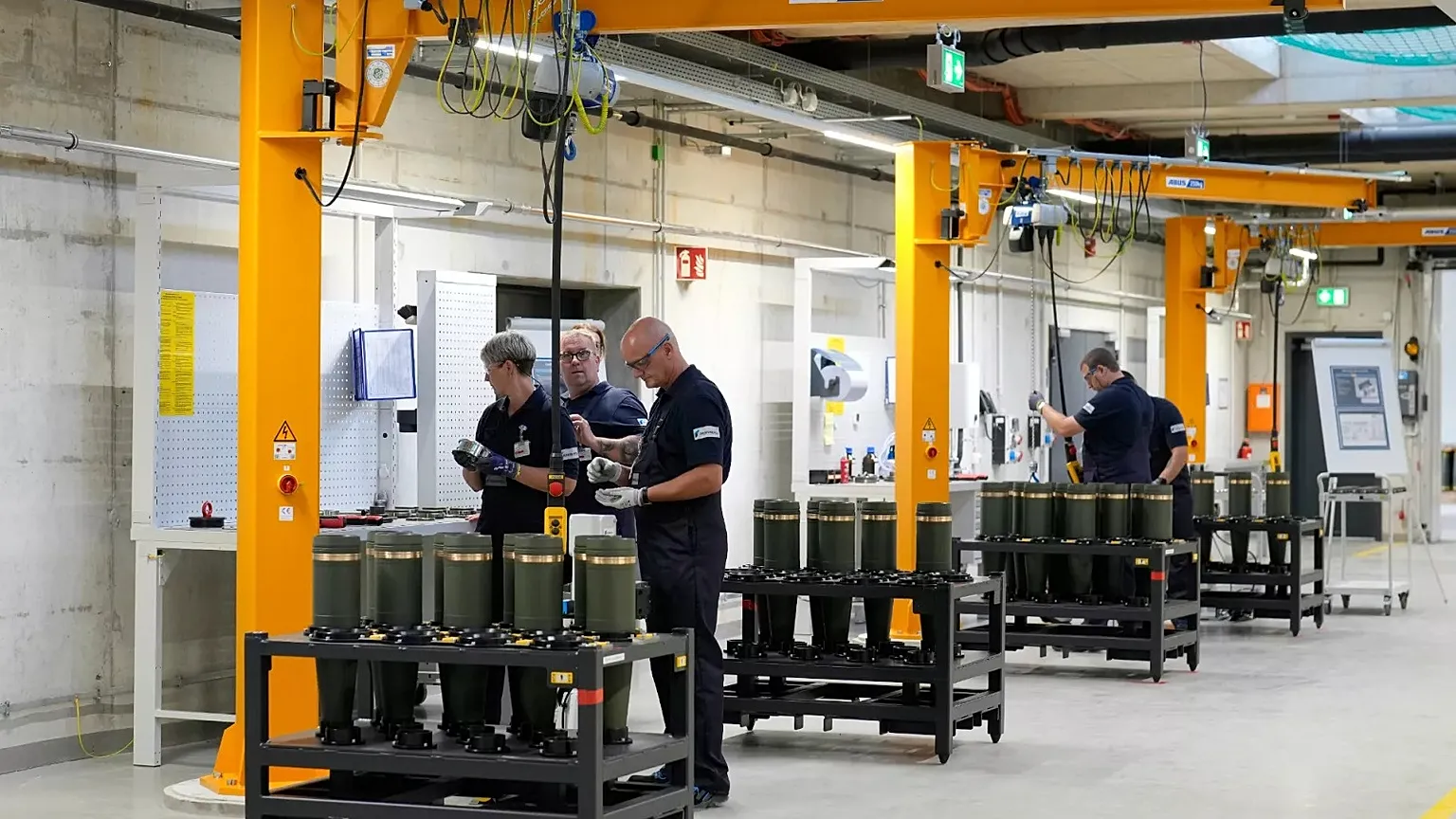 Employees work during a test production run at a newly built artillery ammunition plant by German arms manufacturer Rheinmetall in Unterlüß, 27 August, 2025