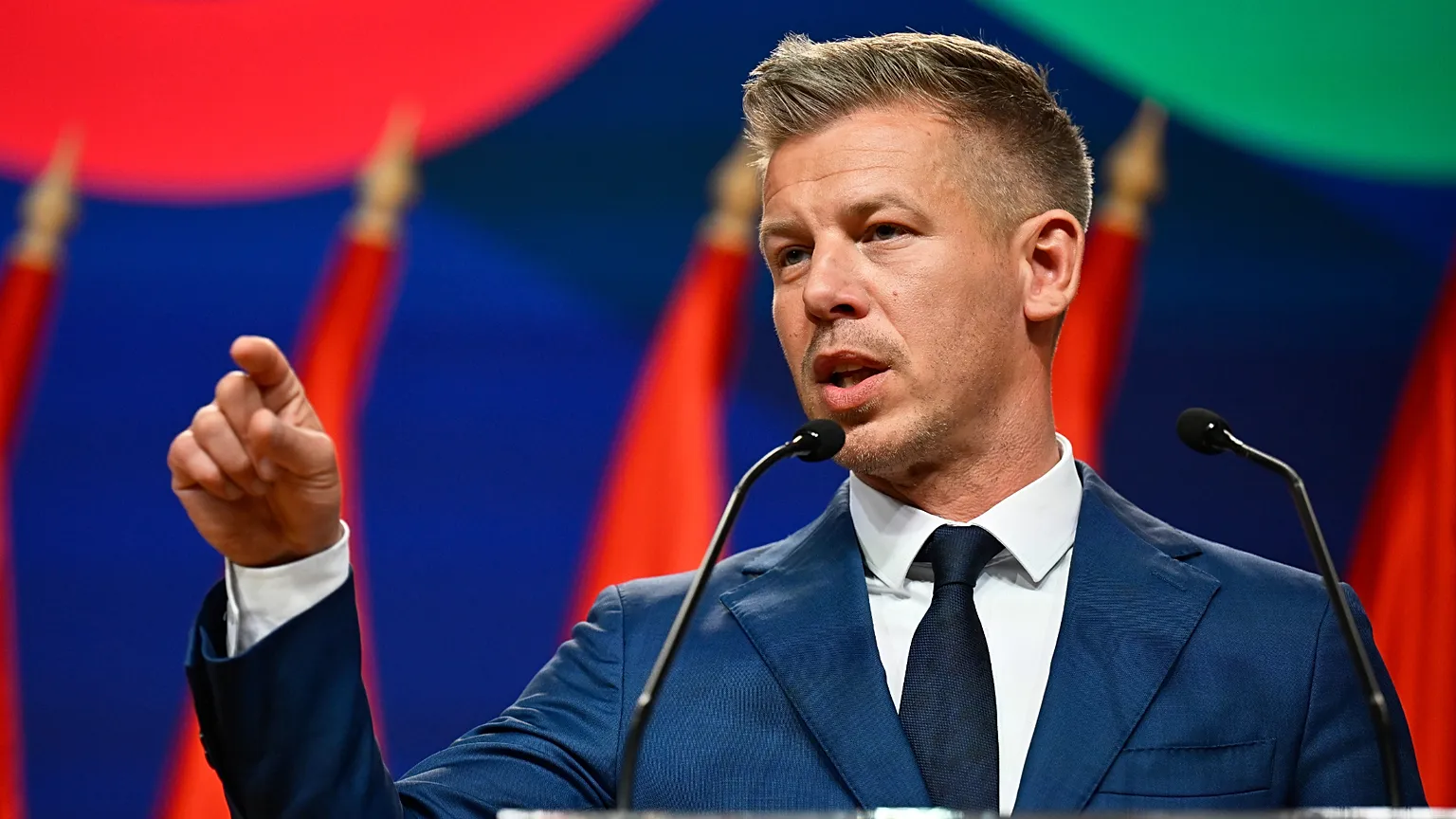 Peter Magyar gestures as he speaks to the media in Budapest, Hungary, Monday, April 13, 2026, after defeating Prime Minister Viktor Orban's party in the country's parliamentar
