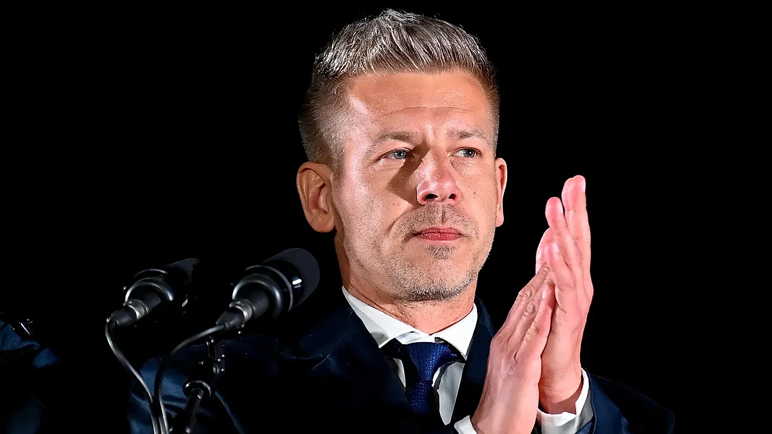 Peter Magyar, leader of the opposition Tisza party, speaks to his supporters following the announcement of the partial results of the parliamentary election, in Budapest, Hung