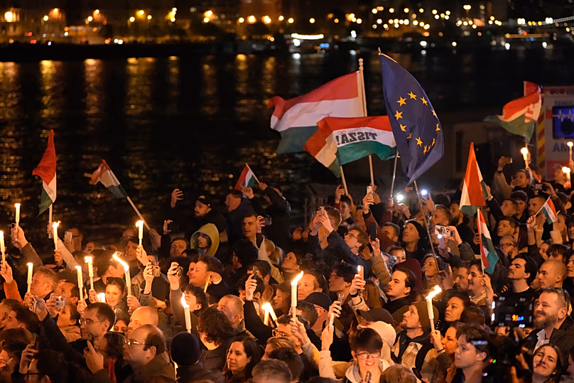 Supporters of Péter Magyar celebrate after a parliamentary election in Budapest, 12 April, 2026