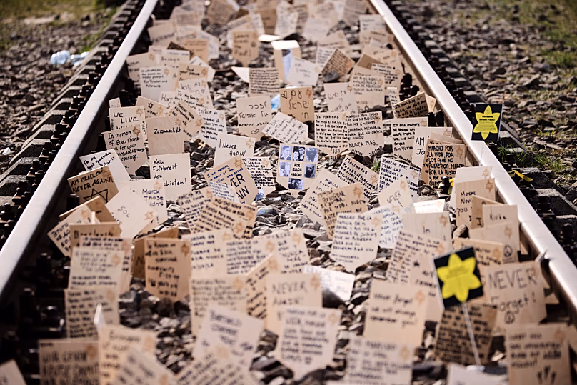 Signs are put between the rails during the annual "March of the Living" to commemorate the Holocaust in Oświęcim, 14 April, 2026