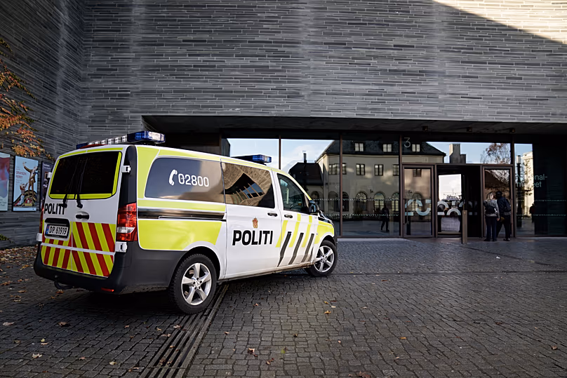 A police vehicle is parked outside the National Museum in Oslo, 11 November, 2022