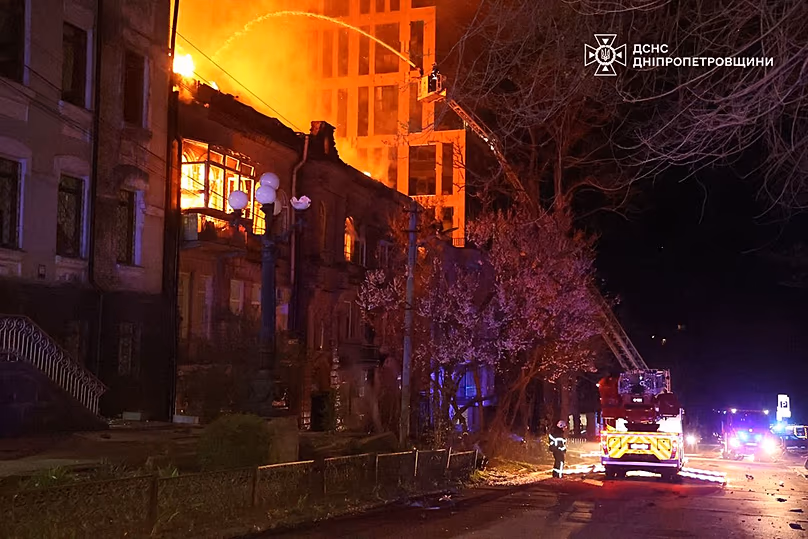 Firefighters put out a fire following a Russian attack in Dnipro, 16 April, 2026