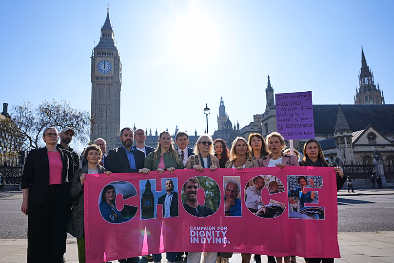 Campaigners hold a banner outside parliament in London as a proposed law to legalise assisted dying in England and Wales ran out of time, 24 April, 2026