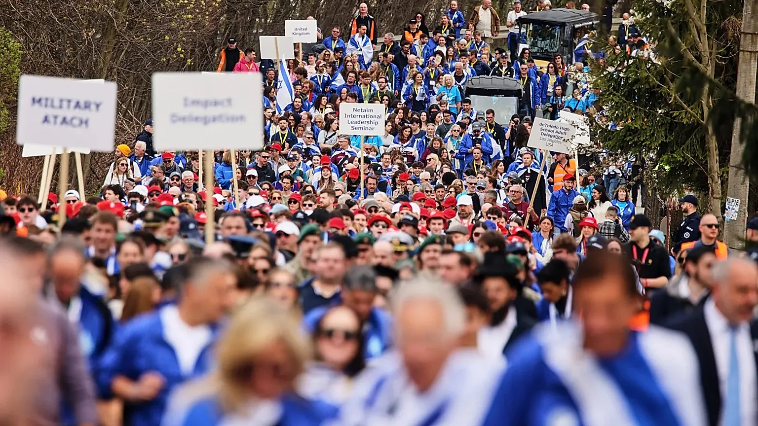 People take part in the annual "March of the Living" to commemorate the Holocaust in Oświęcim, 14 April, 2026