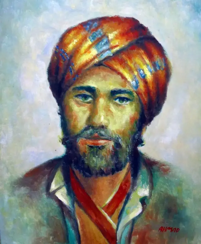 Un retrato a color de Avicena, quien tiene barba y lleva una especie de turbante.