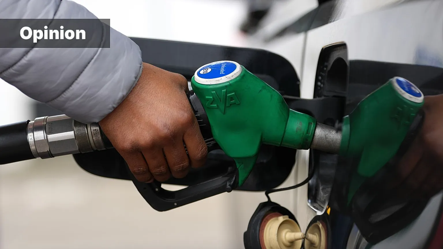 A man fills his car with petrol at a gas station in London, England, Monday, March 30, 2026.