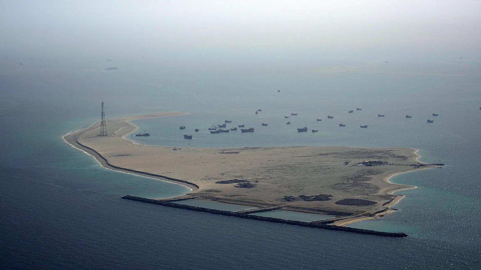 Ships sit anchored off Dubai, United Arab Emirates, Friday, May 19, 2023. 