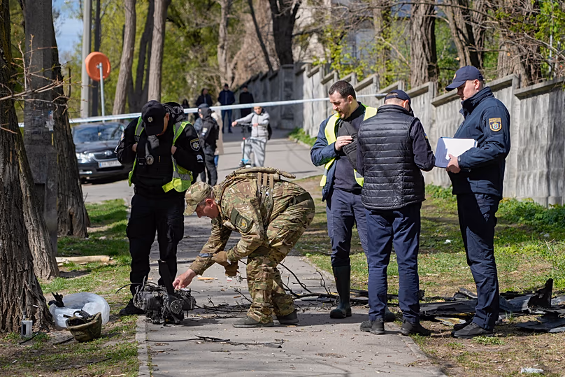 Police officers inspect fragments of a Russian drone after an air attack in Kyiv, 28 April, 2026