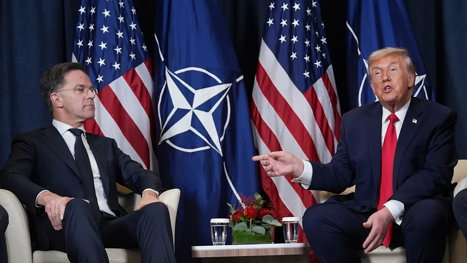 FILE - President Donald Trump, right, meets with NATO Secretary General Mark Rutte in Davos, Switzerland, 21 January 2026