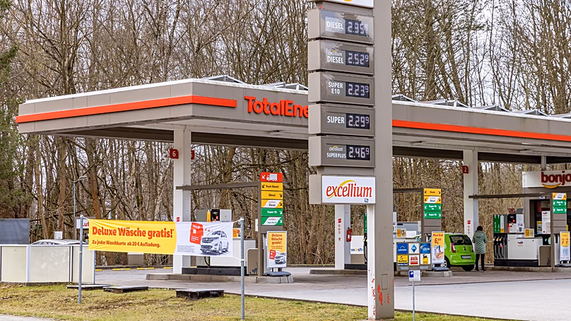 A driver fills up her car shortly before 12 noon, as of today, petrol stations are only allowed to increase prices once a day, at 12.00 noon , Germany, April 1, 2026